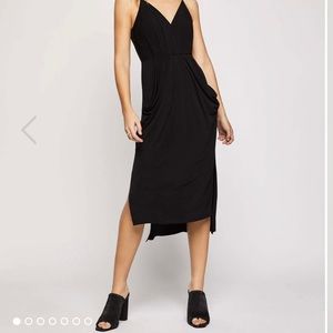 Black BCBG (BCBGeneration) midi dress with pockets.